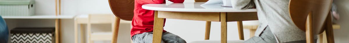 Cute little boy with ADHD during session with professional thera
