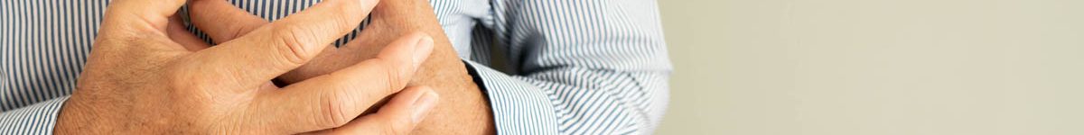 Heart attack problems. Senior man suffering from severe chest pa