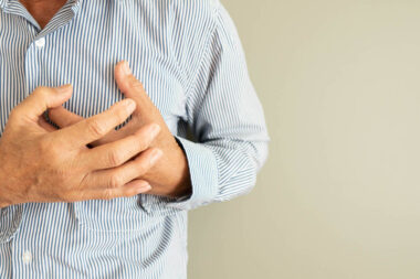 Heart attack problems. Senior man suffering from severe chest pa
