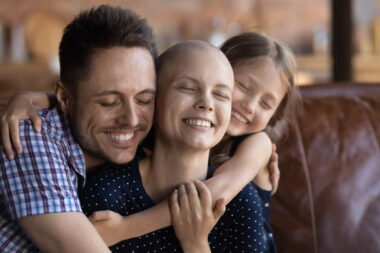 Husband dad and daughter cuddling wife mom fighting against cancer