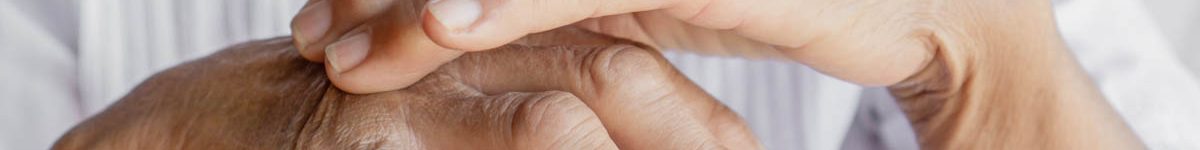 female patient massaging hand and fingers having problem with go