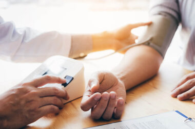Doctor using stethoscope take a tap on the patient’s arm and pre