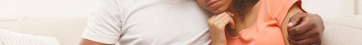 Sad black couple after pregnancy test result