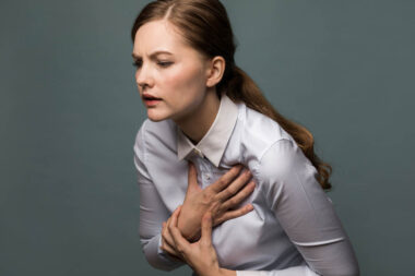 Young woman having heart ache.